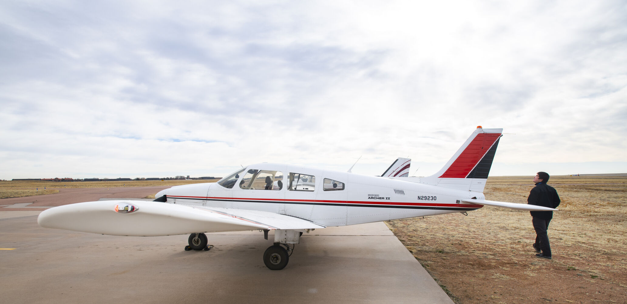 Metropolitan State University of Denver freshman Nolan Shell does a preflight check on a Piper airplane Monday, March 28, 2022, while taking classes at Direct Connect Flight Academy at the Colorado Springs Airport. Shell has logged more than 60 hours of flight time and has earned his private pilot license since starting the program in the fall. (The Gazette, Christian Murdock) (Christian Murdock/The Gazette)