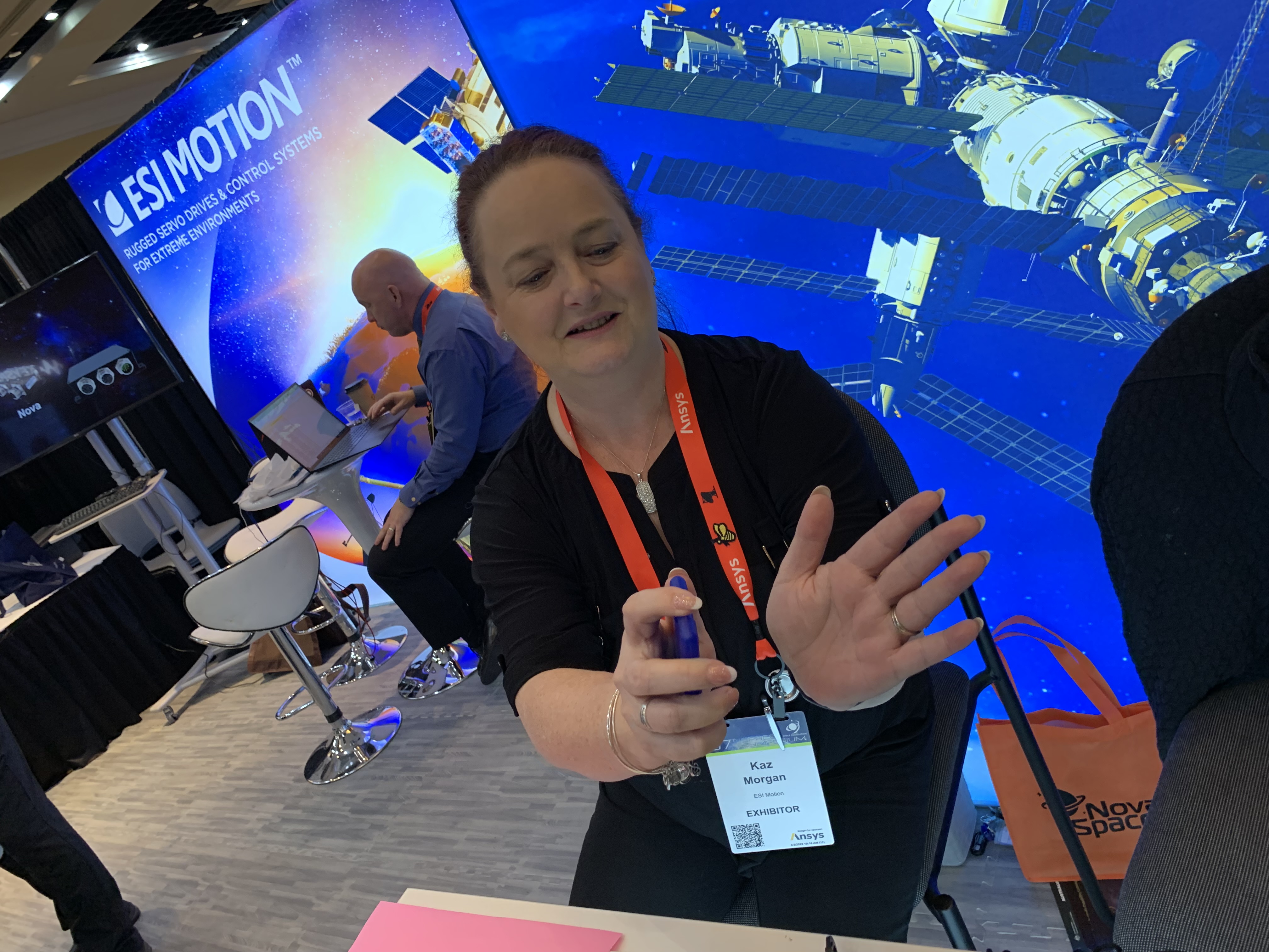 ESI Moiton's Kaz Morgan demonstrates the hand sanitizer, shaped like a business card, the company gave out at the 37th Space Symposium in Colorado Springs last week. (DENNIS HUSPENI/THE DENVER GAZETTE)