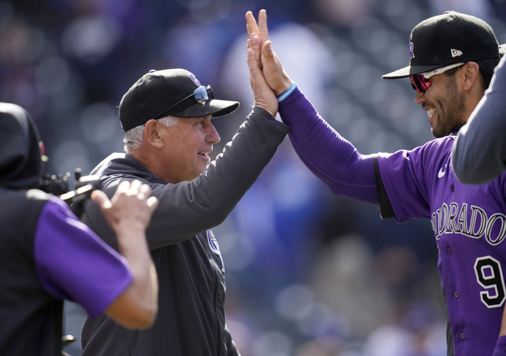 Colorado Rockies manager Bud Black, left, congratulates first baseman Connor Joe after the ninth inning of a baseball game against the Los Angeles Dodgers Sunday, April 10, 2022, in Denver. (AP Photo/David Zalubowski) (David Zalubowski)