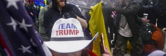 In this Jan. 6, 2021, file photo, insurrections loyal to President Donald Trump try to break through a police barrier at the Capitol in Washington. (John Minchillo/AP)