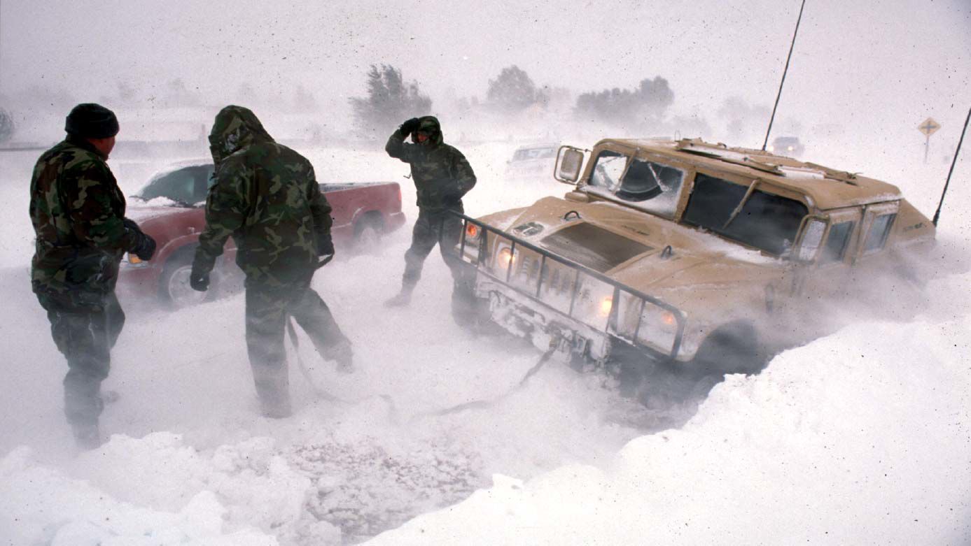 Fort Carson MP's work to loosen a Humvee from a snowbank Saturday afternoon October 25, 1997 on Fontaine Boulevard east of Widefield, Colorado. The vehicle was part of a convoy of four Humvees of MP's heading east toward eastern El Paso County to rescue stranded motorists when it got stuck. (Mark Reis, The Gazette)