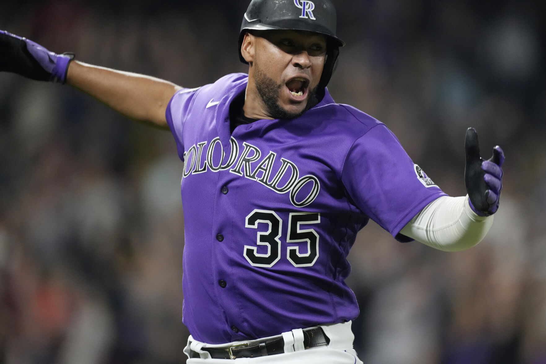 Colorado’s Elias Diaz celebrates his game-ending, three-run home run off Arizona relief pitcher J.B. Wendelken during the ninth inning Aug. 21 in Denver. (The Associated Press)
