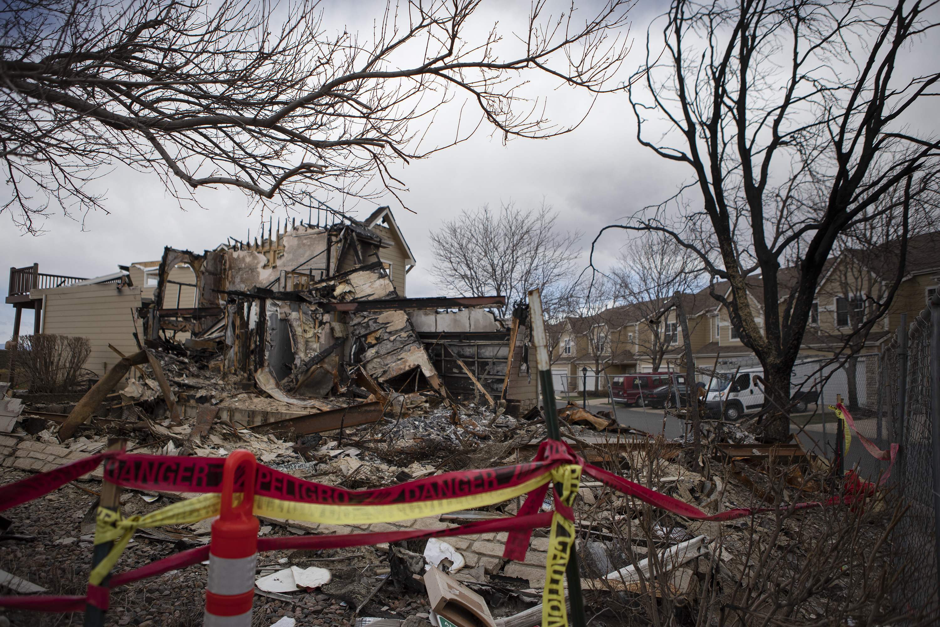 The charred remains of the townhome belonging to Sandy Quiller can be seen among her neighbors’ homes on Wednesday, March 30, 2022, in Superior, Colo. (Timothy Hurst/The Denver Gazette) (Timothy Hurst)