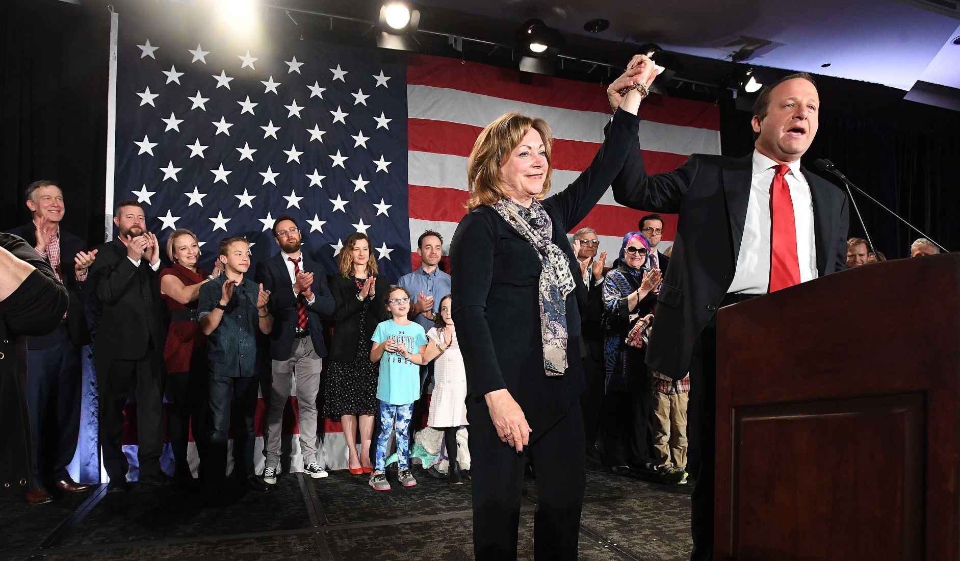 In this file photo, Colorado Gov.-elect Jared Polis lifts the hand of Lt. Gov.-elect Dianne Primavera at the watch party for Colorado Democrats at the Westin hotel in downtown Denver on Nov. 6, 2018. ((Jerilee Bennett/The Gazette, file))