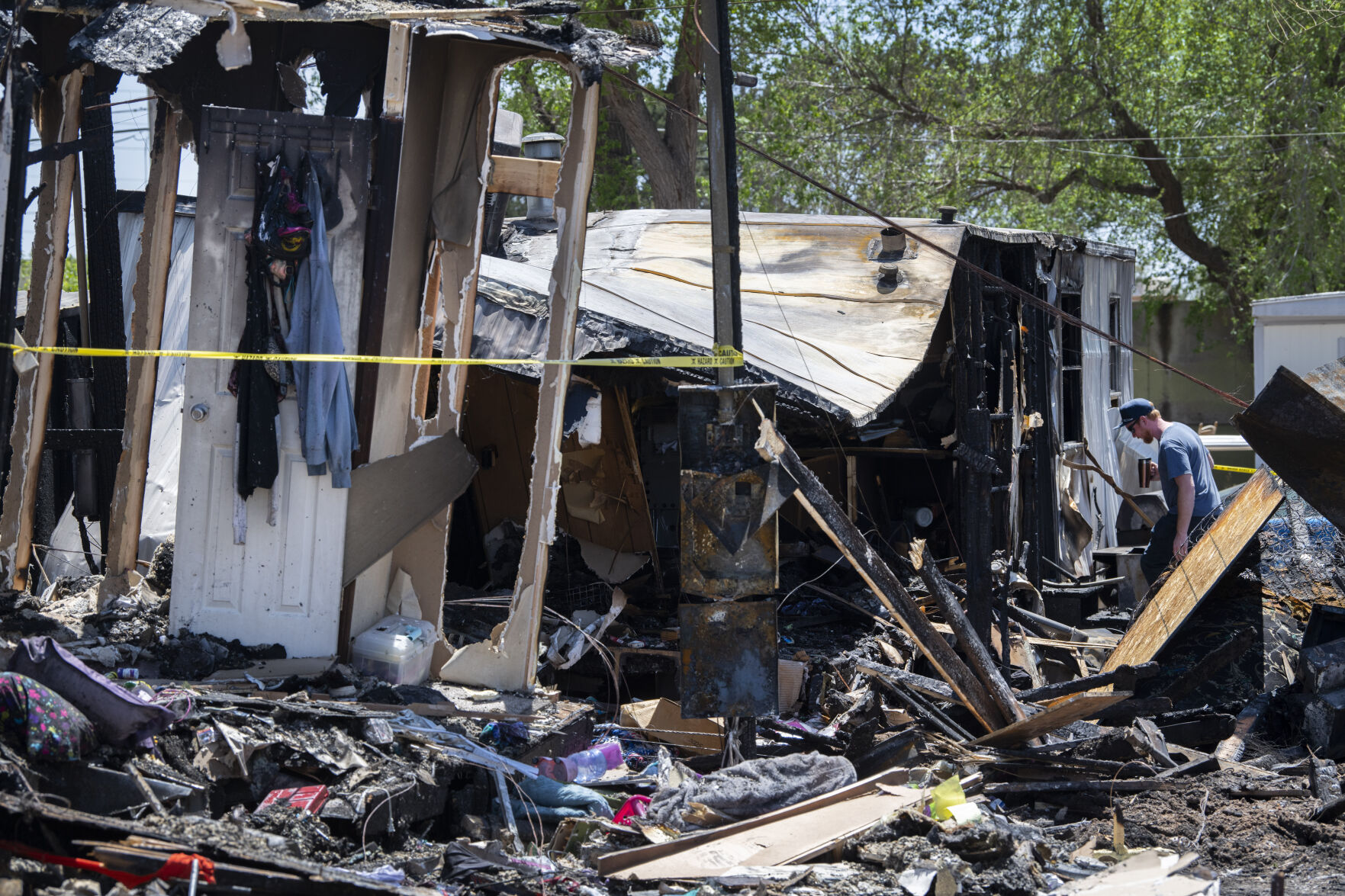 Crews sort through the charred remains Friday, May 13, 2022, of a fire that destroyed eight mobile homes and left one person died at the Falcon Mobile Home Park on North Cascade Avenue in Colorado Springs. The fire started just before noon Thursday and tore through the park as it was fueled by high winds. (The Gazette, Christian Murdock) (Christian Murdock/The Gazette)
