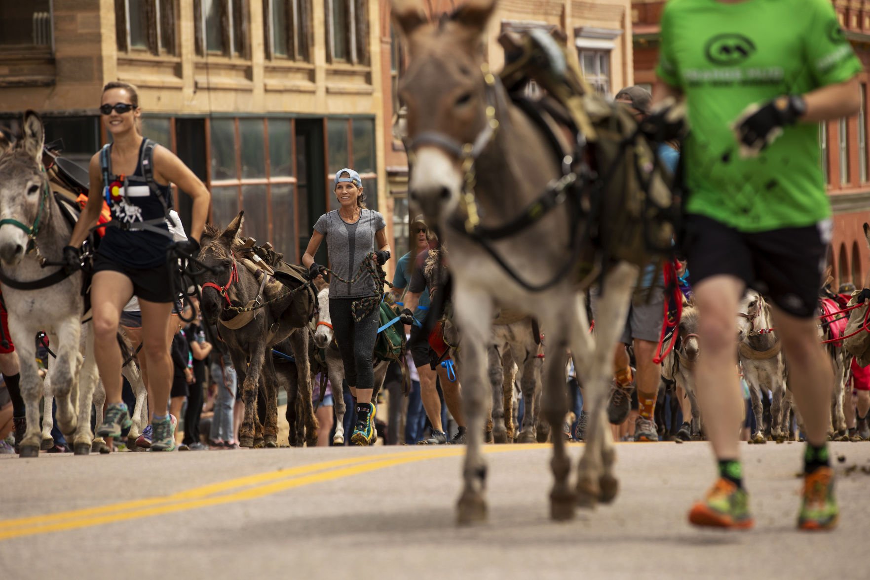 Racers take off with their burros at the start of the Victor Burro Racing Gold Rush Challenge in Victor on Sept. 7, 2019. Burro racing is the official state summer sport. (The Gazette file)