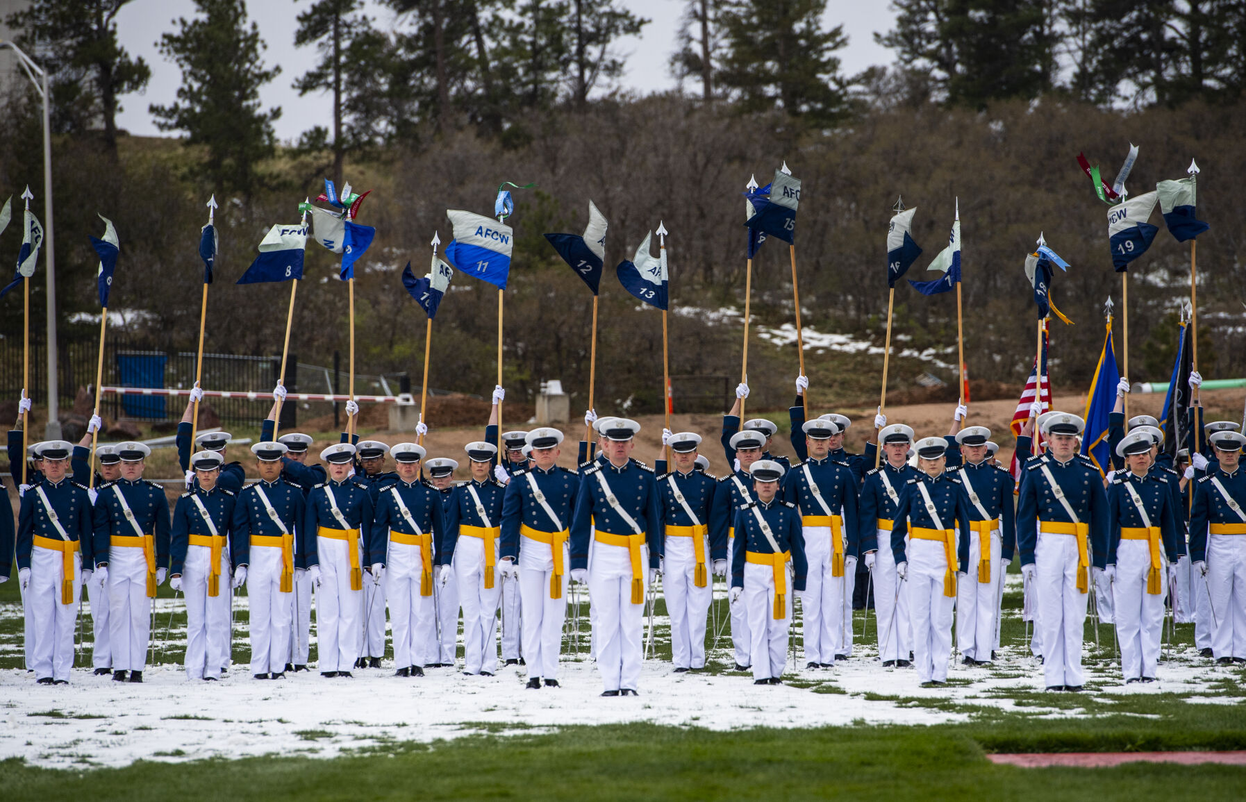 Despite a light drizzle and cold temperatures, prohibiting The Wing Of Blue parachute team from making an appearance, the Air Force Academy’s graduation parade went on as planned at the Sillman Parade Field on Tuesday, May 24. (Parker Seibold / The Gazette) (Parker Seibold / The Gazette)