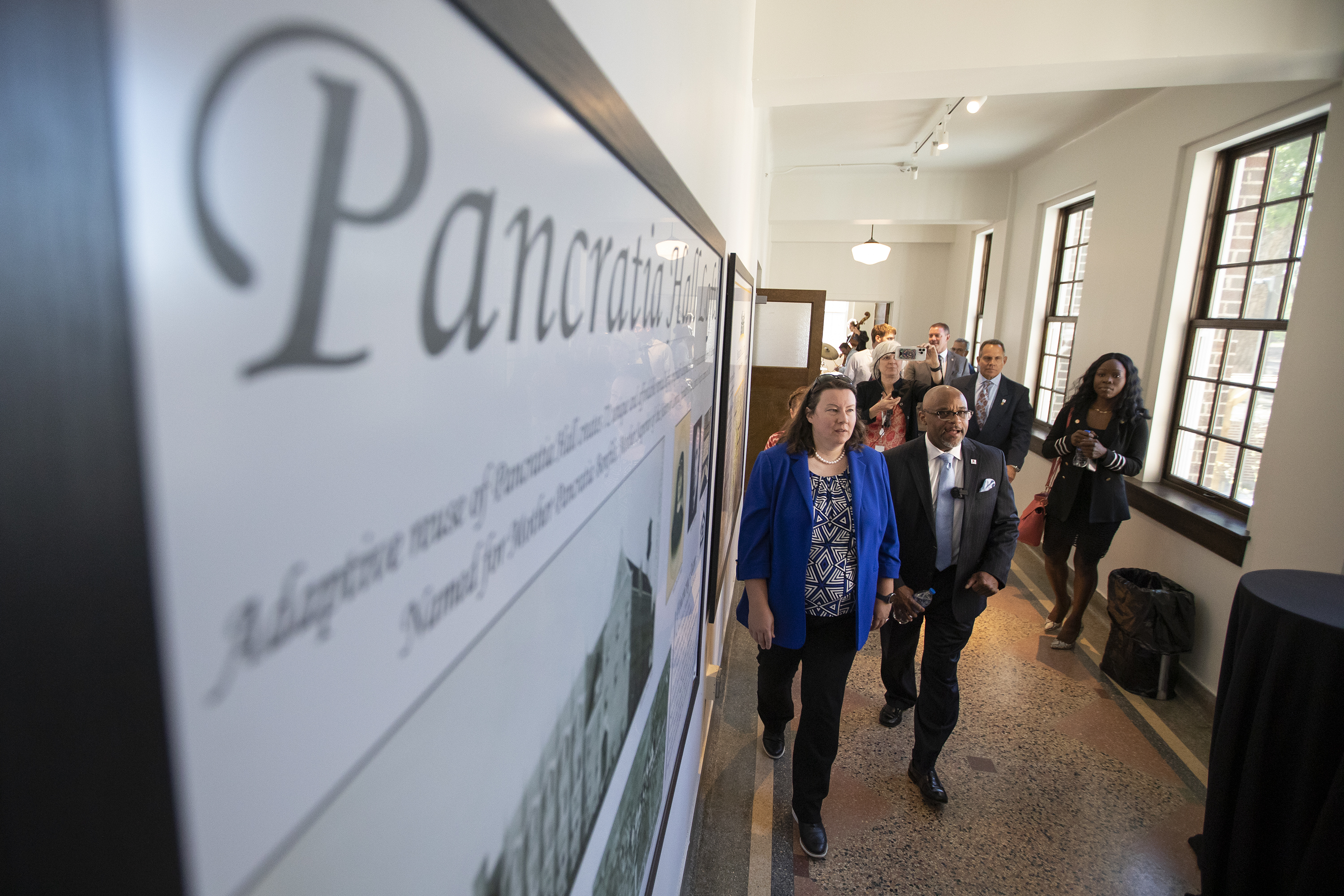 Denver Mayor Michael Hancock, right, and Chief Housing Officer for the City & County of Denver Britta Fisher tour the building during the grand opening of 74 affordable housing units at the newly restored Pancratia Hall on Thursday, May 12, 2022, in Denver, Colo. (Timothy Hurst/The Denver Gazette) (Timothy Hurst)