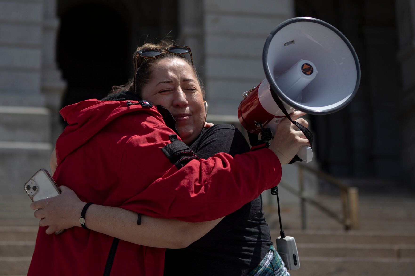Abortion-rights advocate Justine Sandoval, right, hugs community organizer Cidney Fisk after Sandoval spoke during an abortion-rights protest on Tuesday, May 3, 2022, on the west steps of the state Capitol building in Denver, Colo. (Timothy Hurst/The Denver Gazette) (Timothy Hurst)