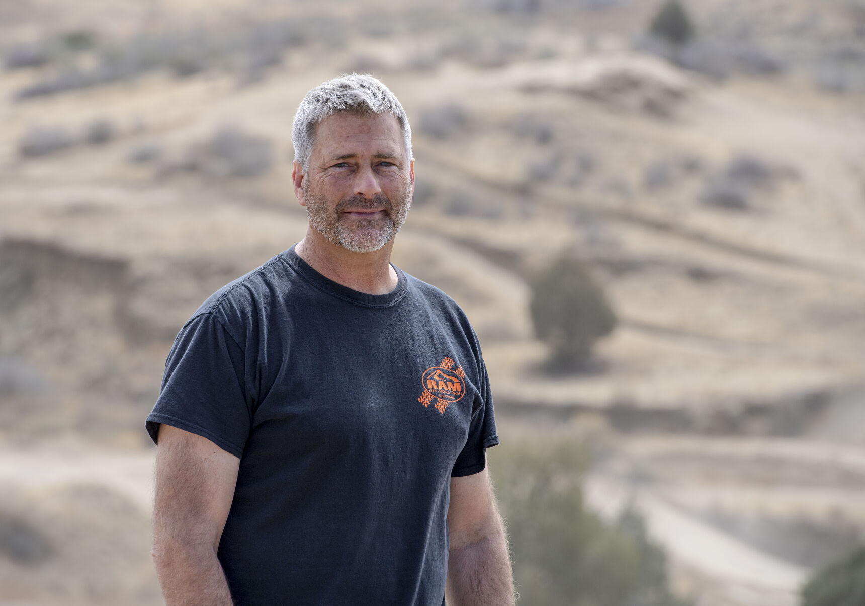 Ray Mandel stands on a hill overlooking trails in RAM Off-Road Park. “We just thought it was a really neat piece of property, so we got a loan and bought it,” his wife, Katrina Mandel, said. “And then Ray just started fiddling around.” The fiddling evolved into he business bearing Ray’s initials and representing his life’s passion. (Parker Seibold / The Gazette) (Parker Seibold / The Gazette)