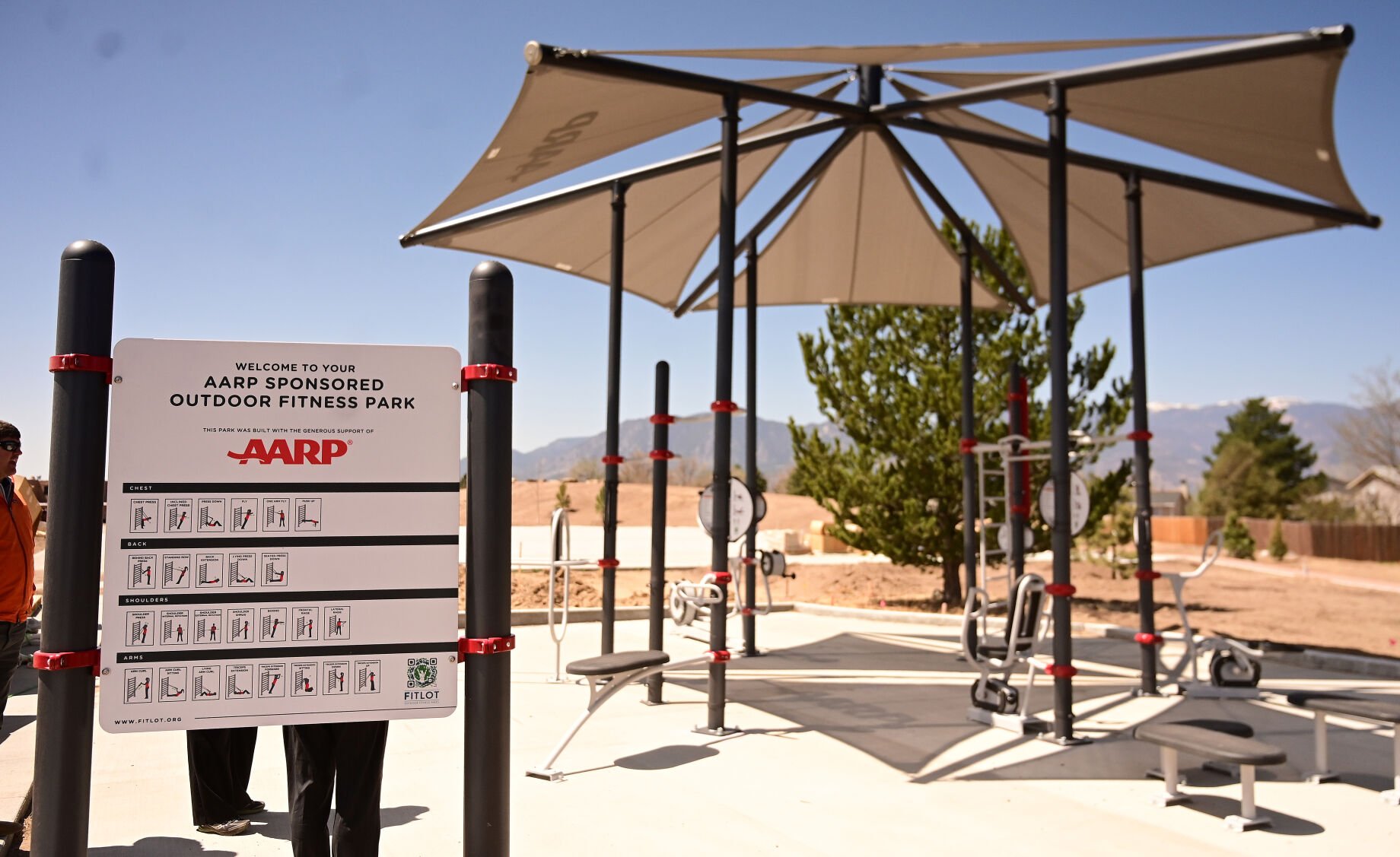 AARP sponsored this outdoor fitness park. Panorama Park will be reopening in southeastern Colorado Springs on July 16 with a complete makeover. Mayor Suthers and other area park representatives toured the park as it nears the end of construction on Tuesday, May 3, 2022. (Photo by Jerilee Bennett, The Gazette) (Jerilee Bennett)