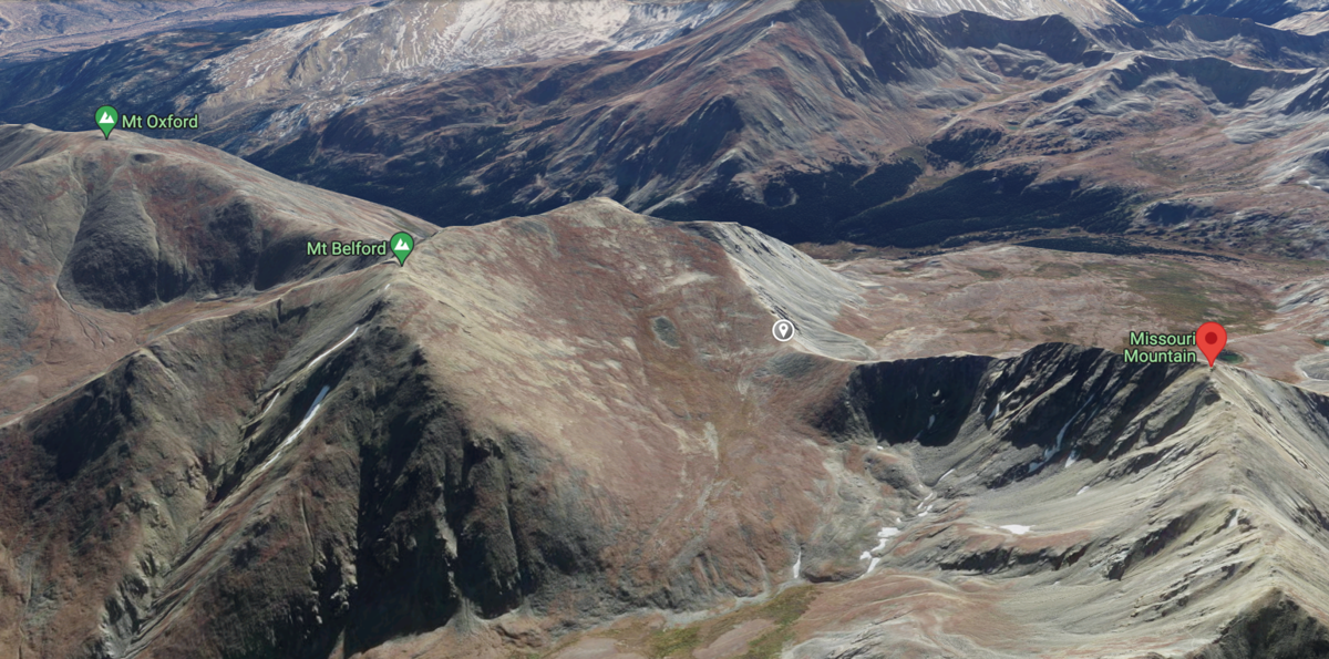 This 3-D rendering shows Missouri Mountain, Mount Belford, and Mount Oxford – three of Colorado's fourteeners. The grey pin located between Missouri and Belford shows the location of Elk Head Pass, with the hiker being found between the pass and the Mis...