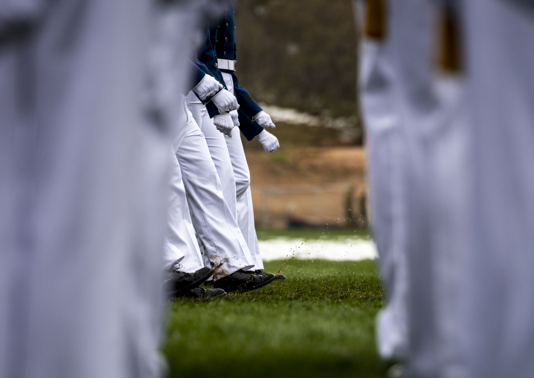 A light drizzle on Tuesday morning made for muddy marching conditions during the Air Force Academy graduation parade at Stillman Parade Field on Tuesday, May 24. (Parker Seibold / The Gazette) (Parker Seibold / The Gazette)