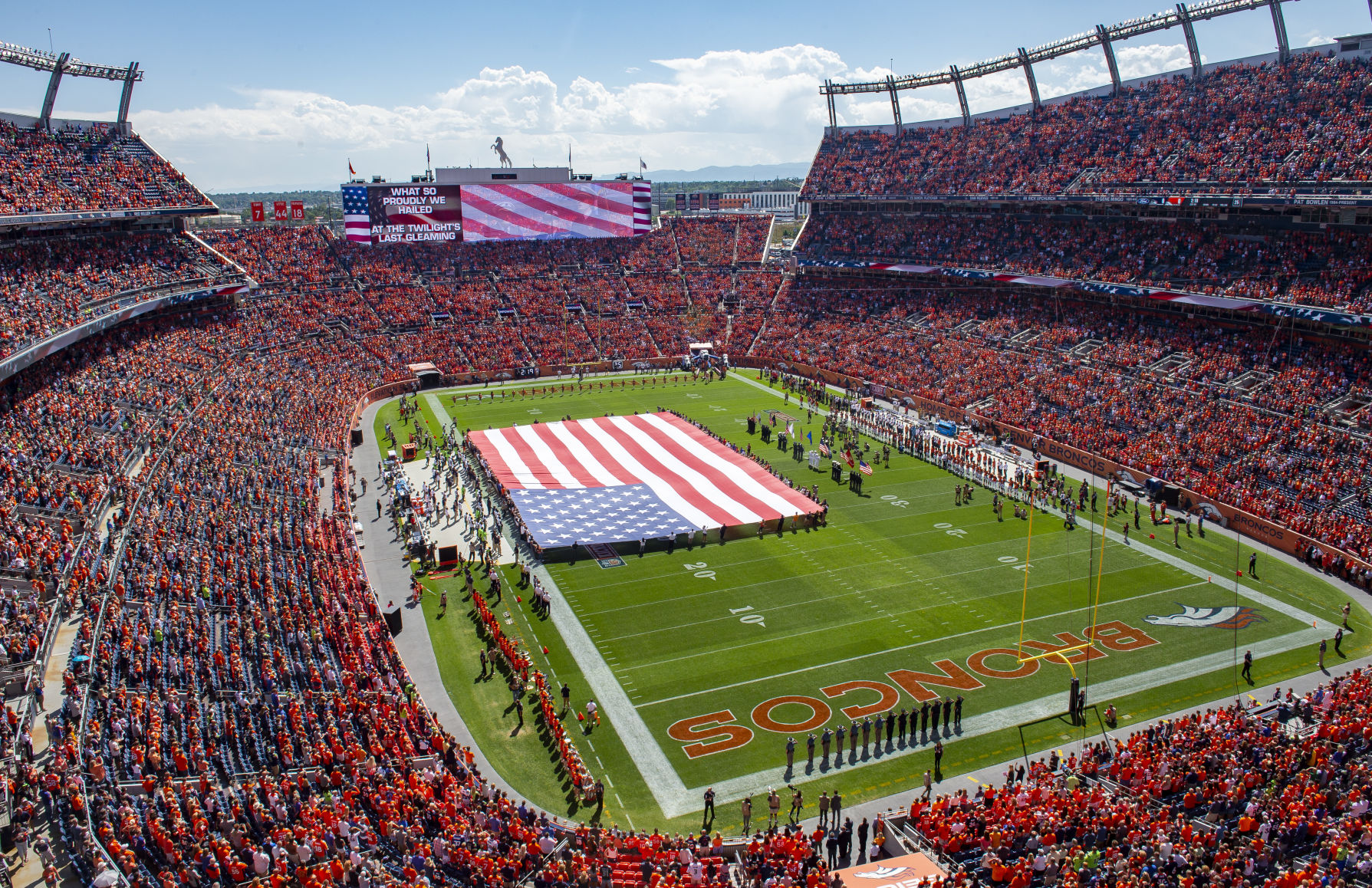A huge flag is brought out during the National Anthem before the start the Denver Broncos season opener against the Seattle Seahawks at Broncos Stadium at Mile High on Sunday, September 9, 2018 in Denver. (Photo by Dougal Brownlie, The Gazette) (Dougal Brownlie, The Gazette)