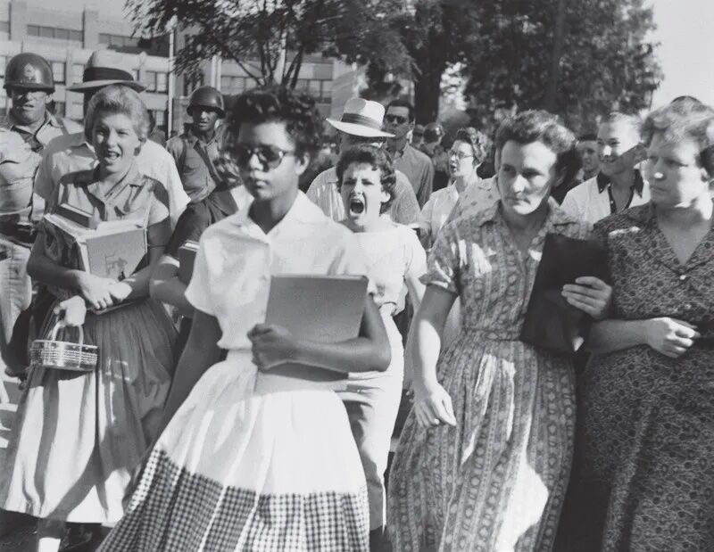 Carlotta Walls walks to class hounded by an angry mob in 1957. (File photo)