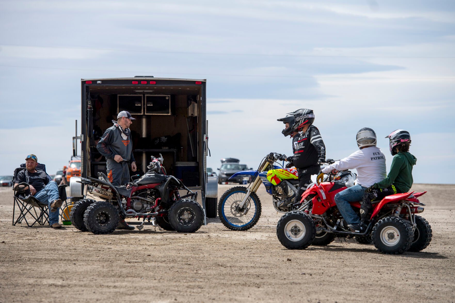 A group of regular park goers gather at Brian Barsh’s trailer as he works on his quad on Saturday, May 7. (Parker Seibold / The Gazette) (Parker Seibold / The Gazette)