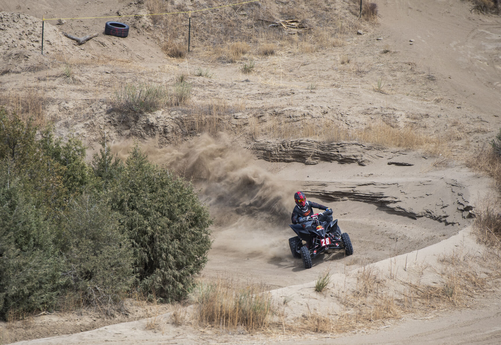 A four-wheeler kicks up a cloud of dust on a corner at RAM Off-Road Park. (Parker Seibold / The Gazette) (Parker Seibold / The Gazette)