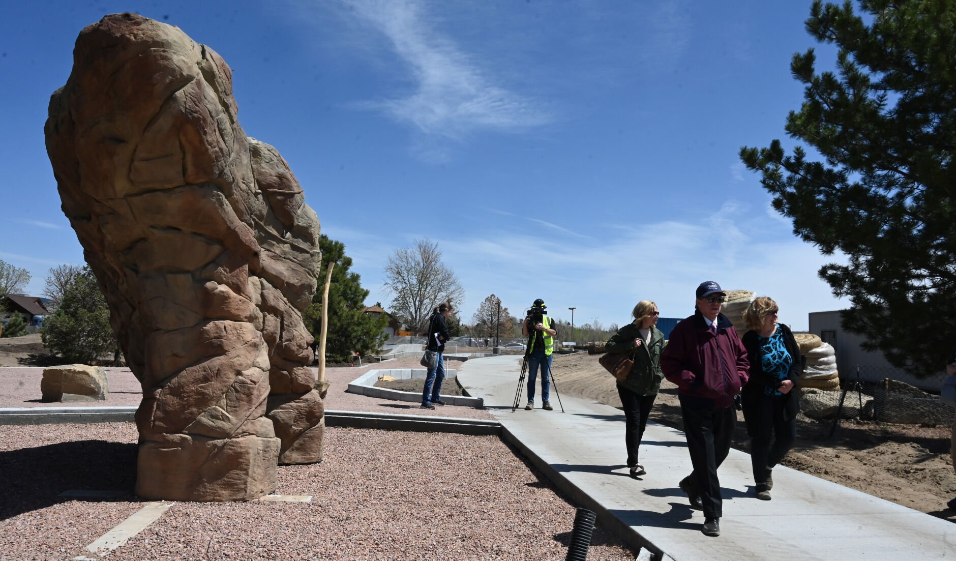 Panorama Park will be reopening in southeastern Colorado Springs on July 16 with a complete makeover. Mayor Suthers and other area park representatives toured the park as it nears the end of construction on Tuesday, May 3, 2022. The tour goes past a climbing rock. (Photo by Jerilee Bennett, The Gazette) (Jerilee Bennett)