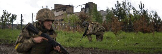 Ukraine drives Russians out of Kharkiv, plants flag on border with Russia, officials say