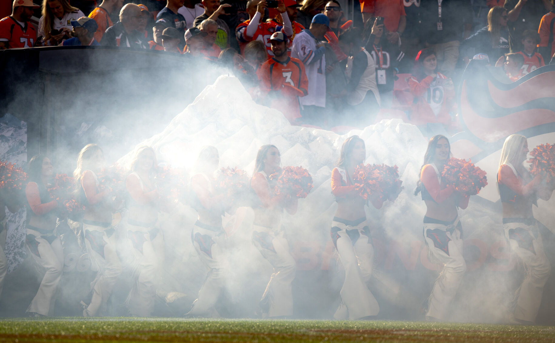 The Broncos cheerleaders enter the field before the start of the Broncos/Los Angeles Chargers game Sunday, Nov. 28, 2021, at Empower Field at Mile High in Denver. (The Gazette, Christian Murdock) (Christian Murdock/The Gazette)
