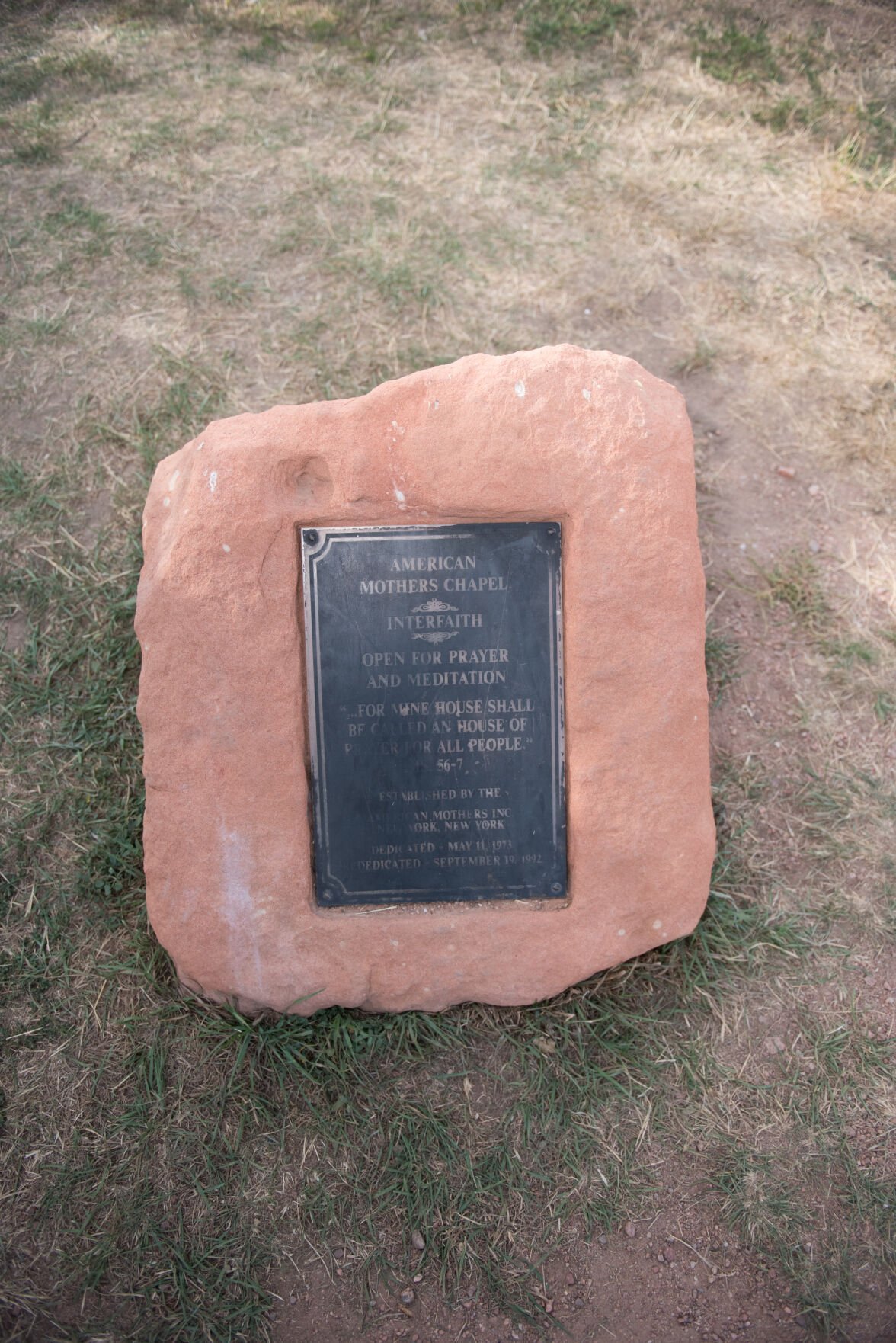 A plaque outside American Mother's Chapel in Colorado Springs shows the small church was dedicated in 1973. (Courtesy of Joe and Robin Photography)