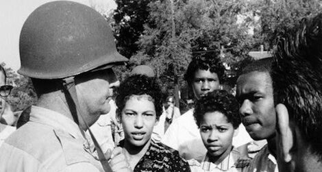 Carlotta Walls, second from left, is prevented from entering Little Rock's Central High School by a National Guardsman in 1957.
