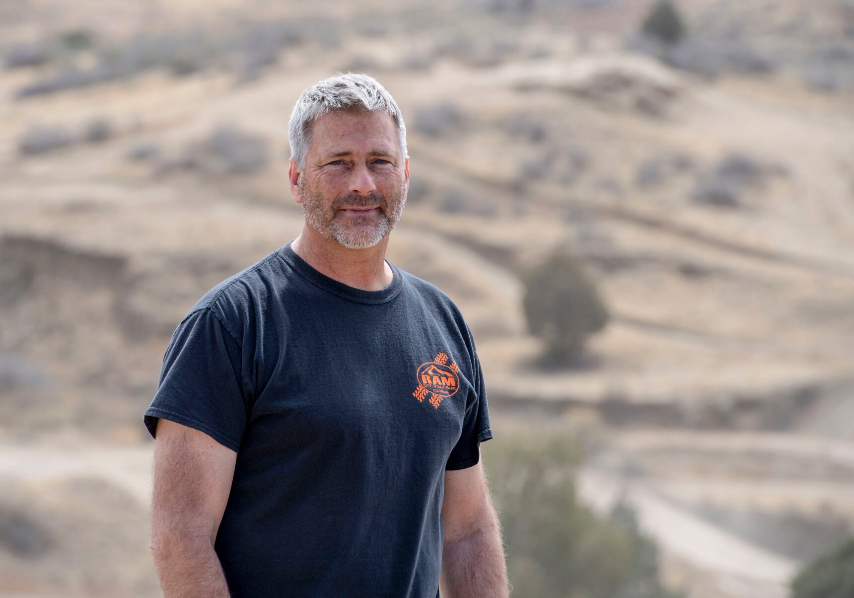 Ray Mandel stands on a hill overlooking trails in RAM Off-Road Park. “We just thought it was a really neat piece of property, so we got a loan and bought it,” his wife, Katrina Mandel, said. “And then Ray just started fiddling around.” The fiddling evolved into he business bearing Ray’s initials and representing his life’s passion. (Parker Seibold / The Gazette) (Parker Seibold / The Gazette)