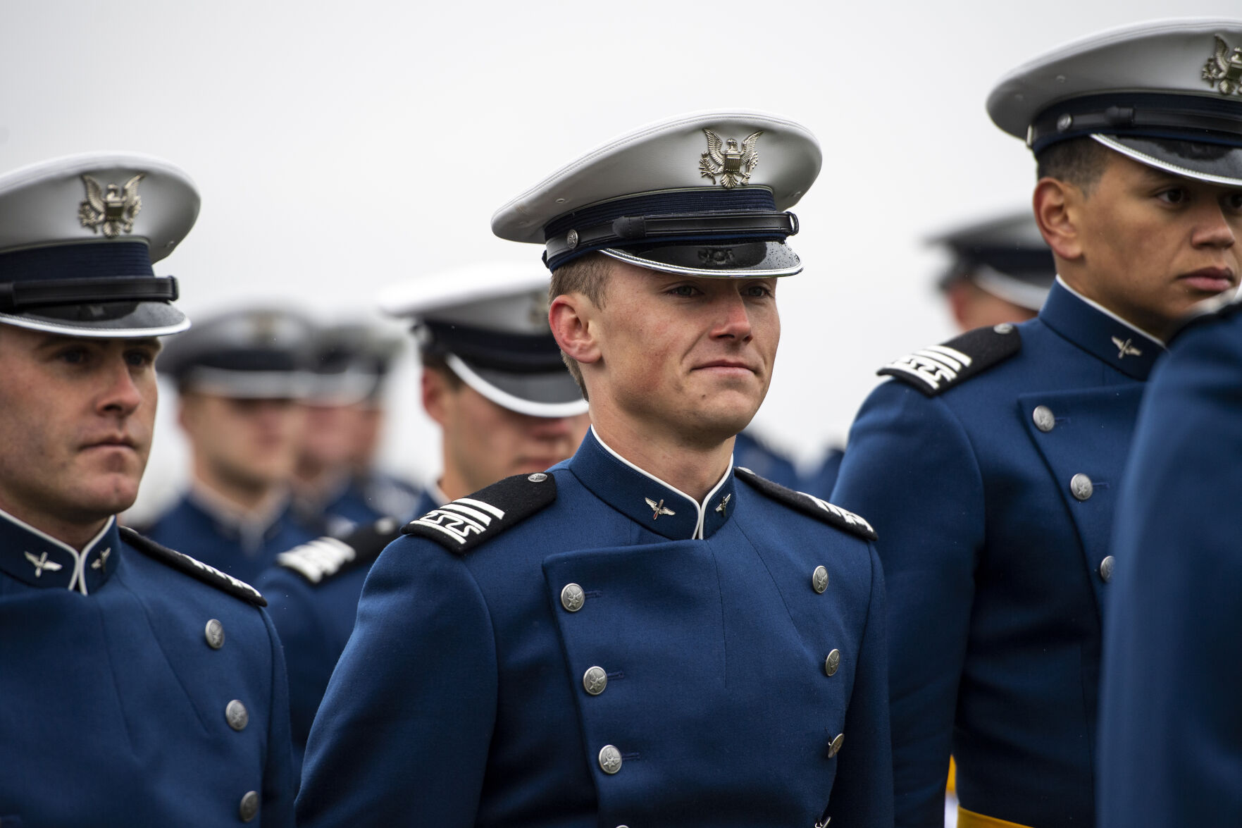 Despite a light drizzle and cold temperatures, prohibiting The Wing Of Blue parachute team from making an appearance, the Air Force Academy’s graduation parade went on as planned at the Sillman Parade Field on Tuesday, May 24. (Parker Seibold / The Gazette) (Parker Seibold / The Gazette)