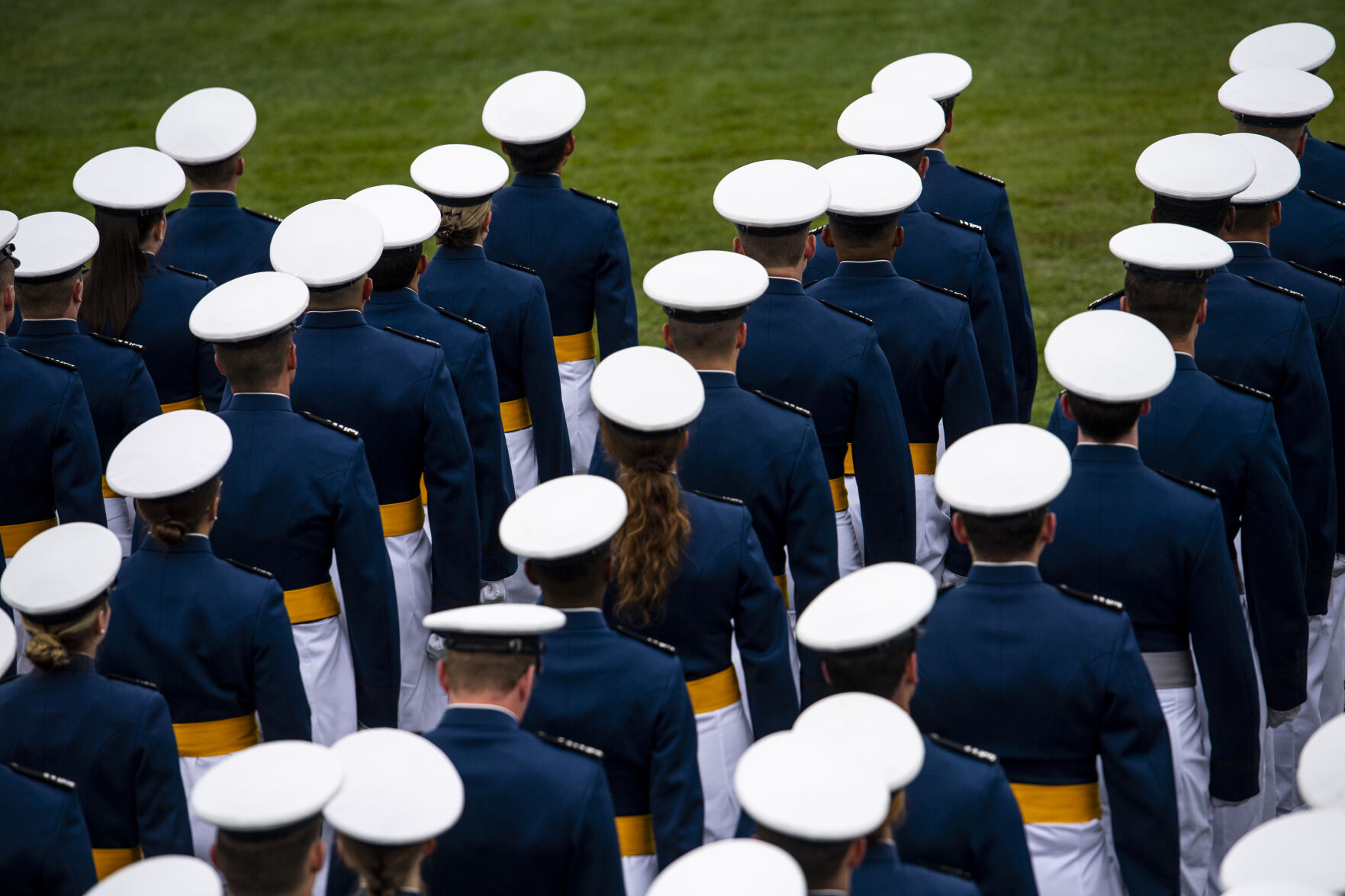 Despite a light drizzle and cold temperatures, prohibiting The Wing Of Blue parachute team from making an appearance, the Air Force Academy’s graduation parade went on as planned at the Sillman Parade Field on Tuesday, May 24. (Parker Seibold / The Gazette) (Parker Seibold / The Gazette)