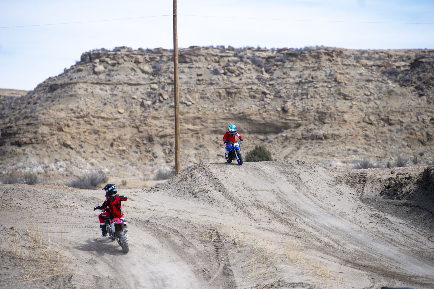 Two young riders pass each other as they practice on the kids track. (Parker Seibold / The Gazette) (Parker Seibold / The Gazette)