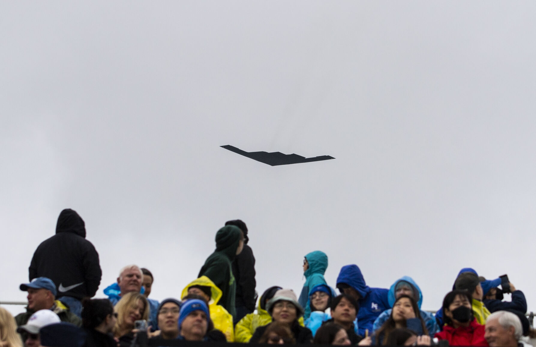 A B-2 stealth bomber flies over the crowd during the Air Force Academy graduation parade at Stillman Parade Field on Tuesday, May 24. (Parker Seibold / The Gazette) (Parker Seibold / The Gazette)