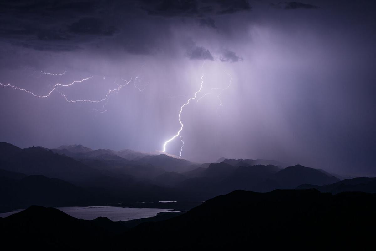 Lightning strike hitting a mountain Photo Credit: mdesigner125 (iStock).