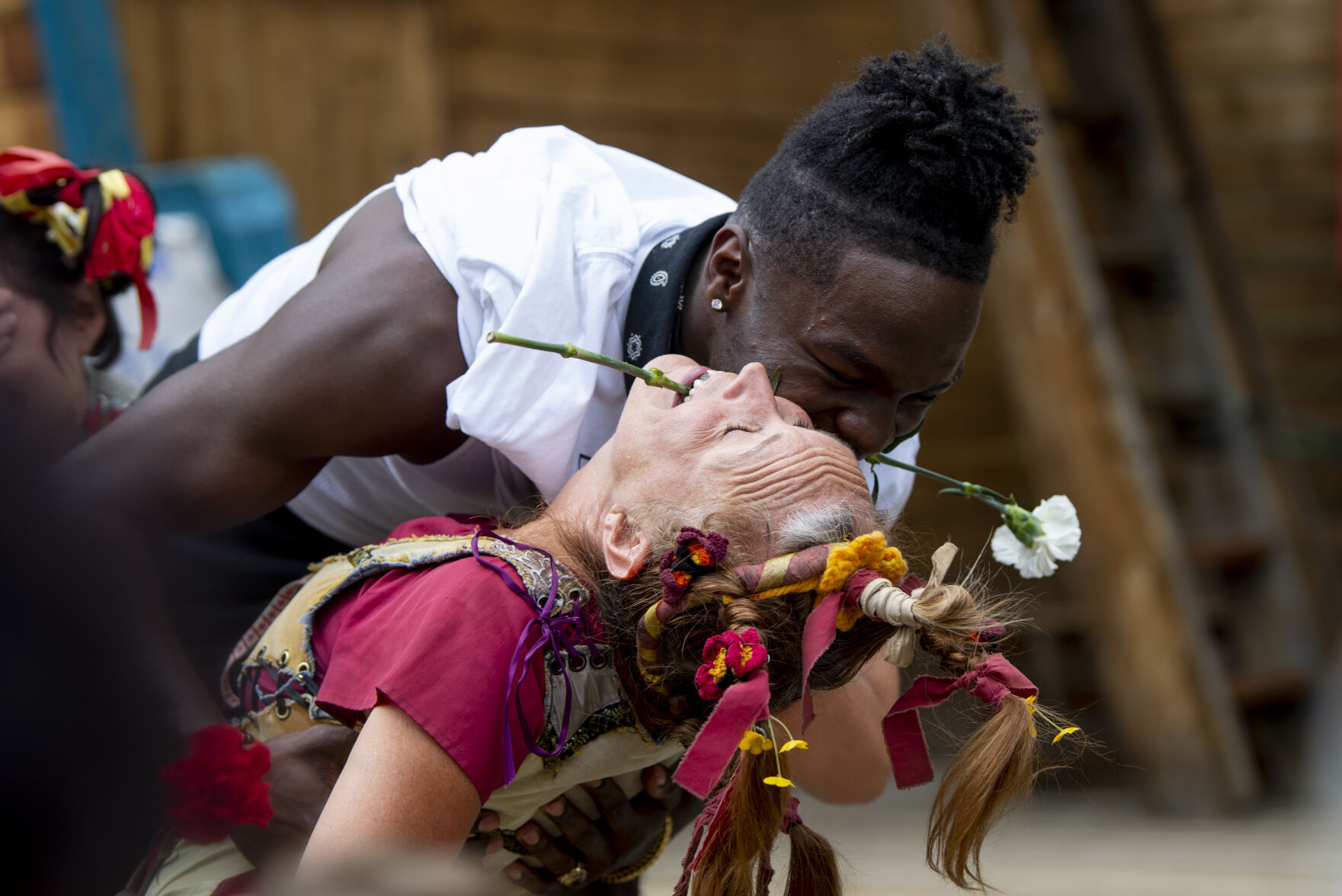 An audience member participates in the Washing Wenches show and retrieves a flower for his girlfriend from the mouth of Gerty at the Colorado Renaissance Festival in Larkspur on Saturday, July 16, 2022. The festival runs every Saturday and Sunday from 10 a.m. to 6:30 p.m. through August 7. (Parker Seibold / The Gazette) (Parker Seibold / The Gazette)