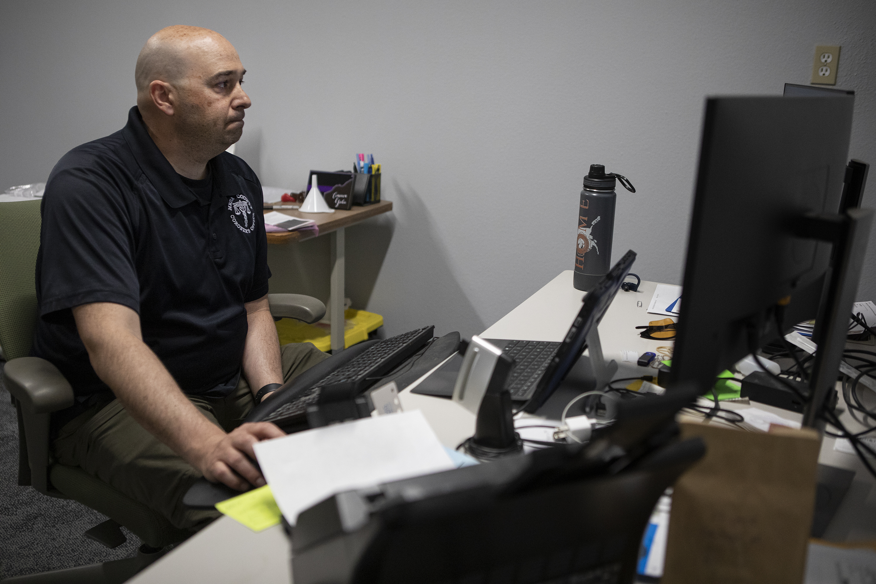 Mesa County coroner Victor Yahn reacts as he opens and reads an autopsy report for a man who’s death was deemed accidental with a cause of death declared as being due to fentanyl and methamphetamine on Monday, April 18, 2022, at the Mesa County Coroner’s Office in Grand Junction, Colo. (Timothy Hurst/The Denver Gazette) (Timothy Hurst)