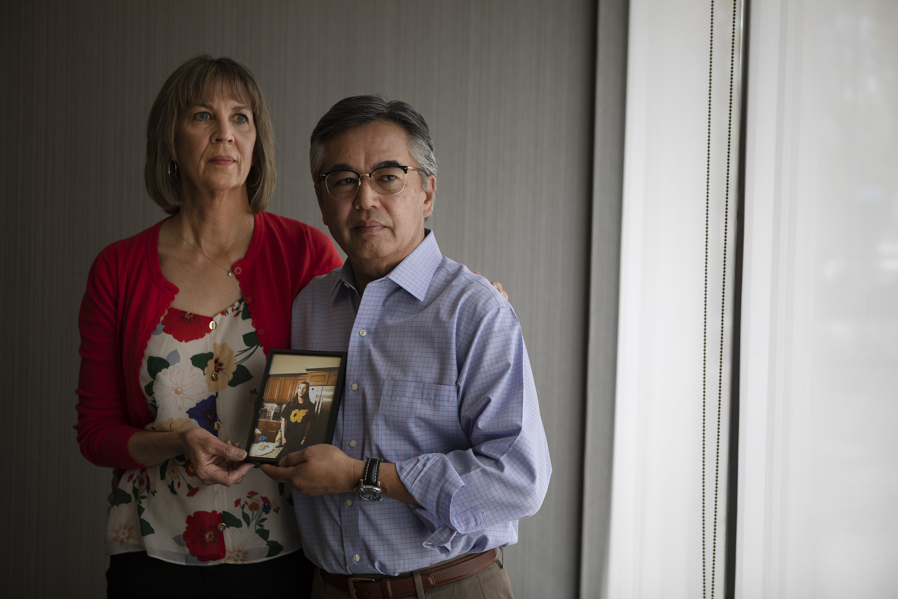 Sandy and her husband D.C. pose for a portrait with a photograph of their son Daniel, who died from fentanyl, as seen on Tuesday, April 19, 2022, in Grand Junction, Colo. (Timothy Hurst/The Denver Gazette) (Timothy Hurst)