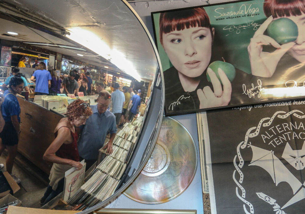 A look through the mirror and closing-day crowd at Albums on the Hill, with Suzanne Vega looking on. (JohnMooreSenior Arts Journalistjohn.moore@denvergazette.comhttps://denvergazette.com/content/tncms/avatars/e/1e/bc8/e1ebc854-8dbc-11ec-90b8-e393b5c0a2b9.afcf882df81bc4eba7366657cc603f75.png)
