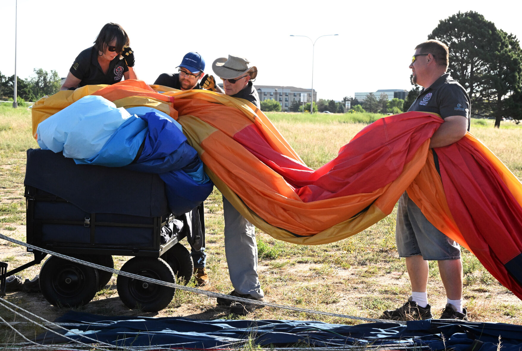 The crew for David Hettick’s balloon pack it away inside a small container after a flight during the Labor Day Lift Off. (Photo by Jerilee Bennett, The Gazette) (Jerilee Bennett)