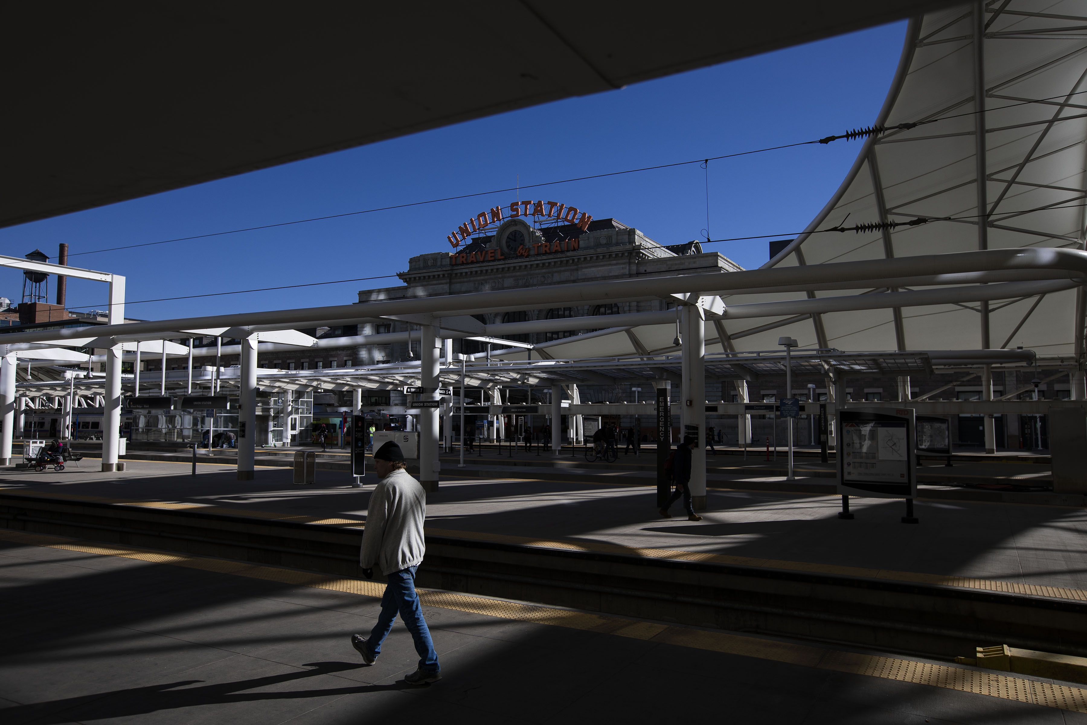 A pedestrian walks past the light rail train platforms at Union Station on Friday, Dec. 17, 2021, in Denver, Colo. (Timothy Hurst/The Gazette) (TimHursttim.hurst@gazette.comhttps://secure.gravatar.com/avatar/aca82bd62b4ee425c598527cd6faa1b1?d=mm&r=g)