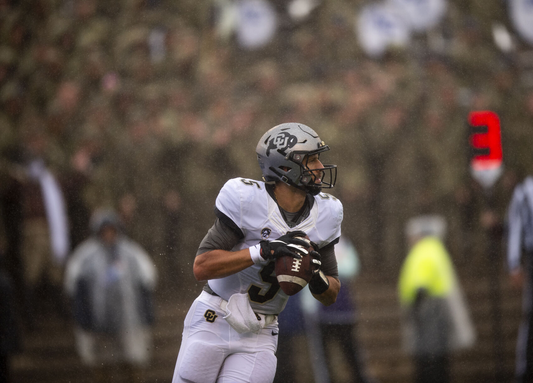 Buffaloes quarterback J.T. Shrout competes in the fourth quarter Saturday at the Air Force Academy. (Parker Seibold, The Gazette)