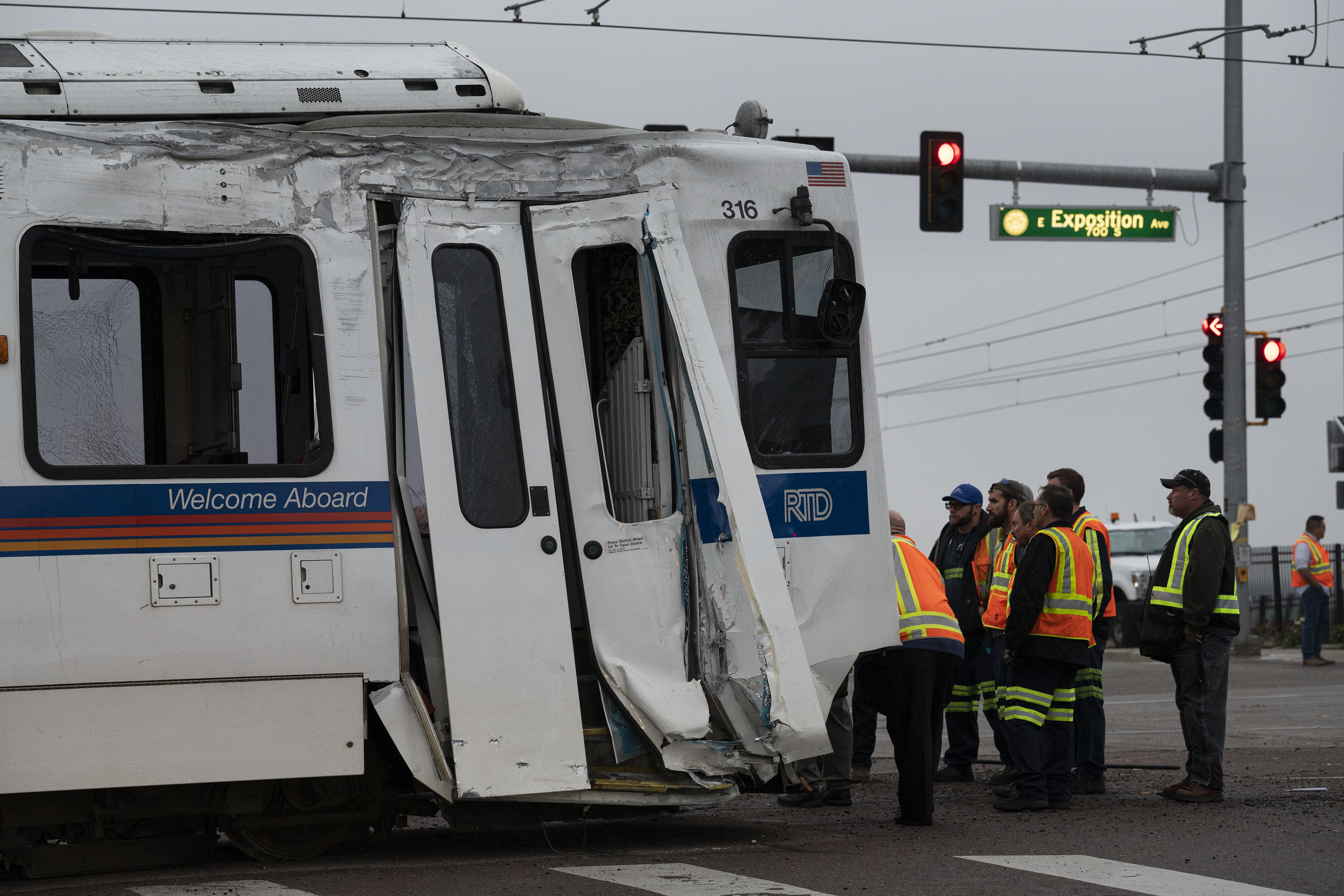 Crews look over one section of a RTD light-rail train that derailed at the intersection of East Exposition Avenue and South Sable Boulevard on Wednesday, Sept. 21, in Aurora, Colo.(TIMOTHY HURST/THE DENVER GAZETTE) (TimHursttim.hurst@gazette.comhttps://secure.gravatar.com/avatar/aca82bd62b4ee425c598527cd6faa1b1?d=mm&r=g)