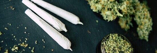 Marijuana on a table with some rolled into a blunt (Gazette file photo)