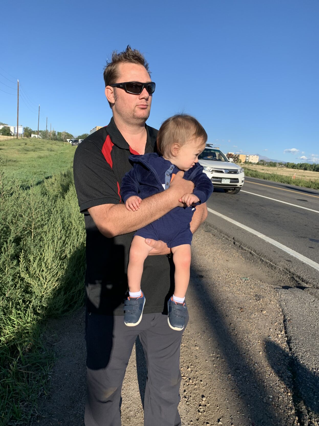 Dad, 16-month-old son watch police from all over in procession for fallen Arvada officer