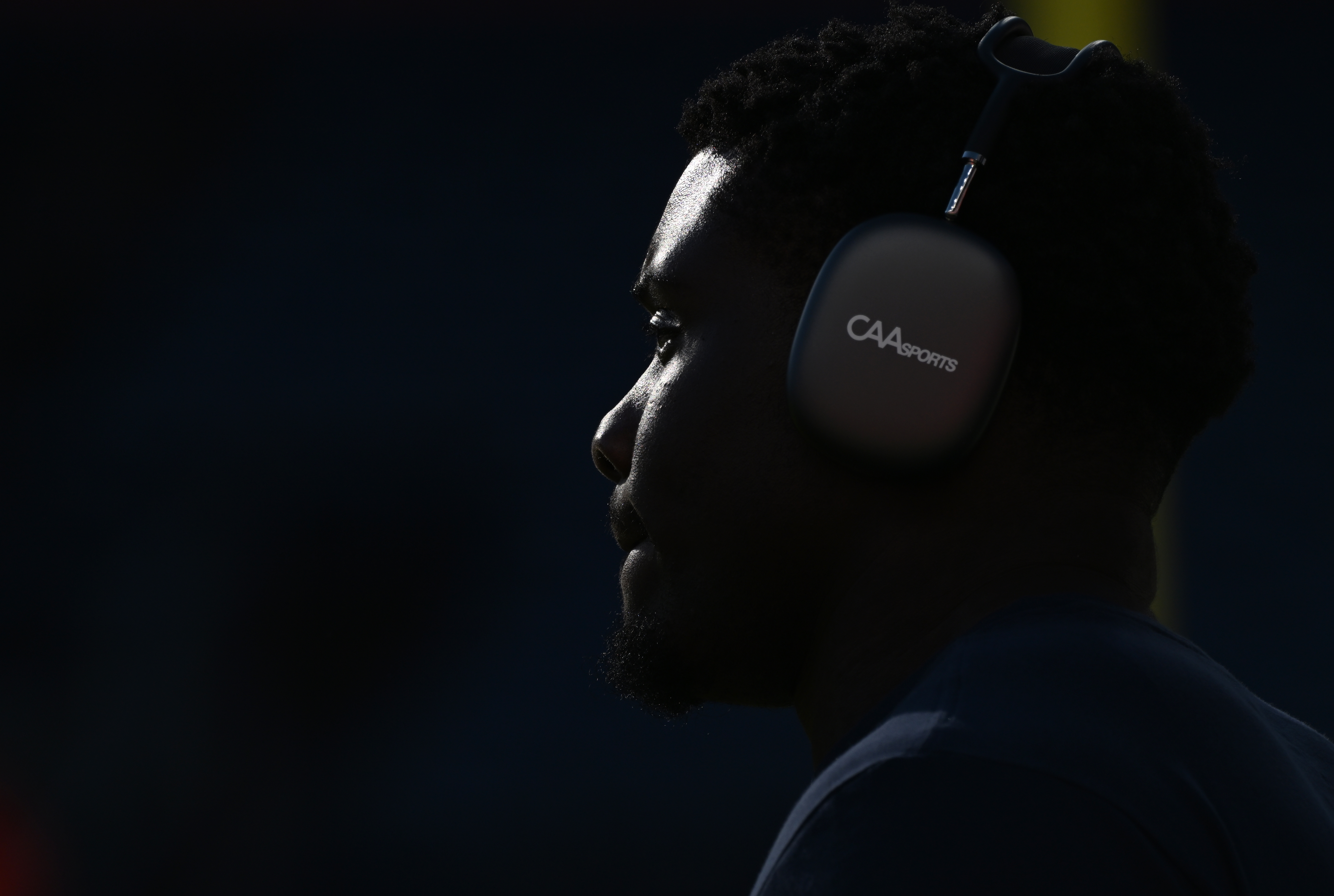 The late afternoon sun casts a spotlight on Denver Broncos center Lloyd Cushenberry III (79) as he warms up before the Denver Broncos game against the San Francisco 49ers Sunday, Sept. 25, 2022, at Empower Field at Mile High in Denver. (The Gazette, Christian Murdock) (Christian Murdock/The Gazette)