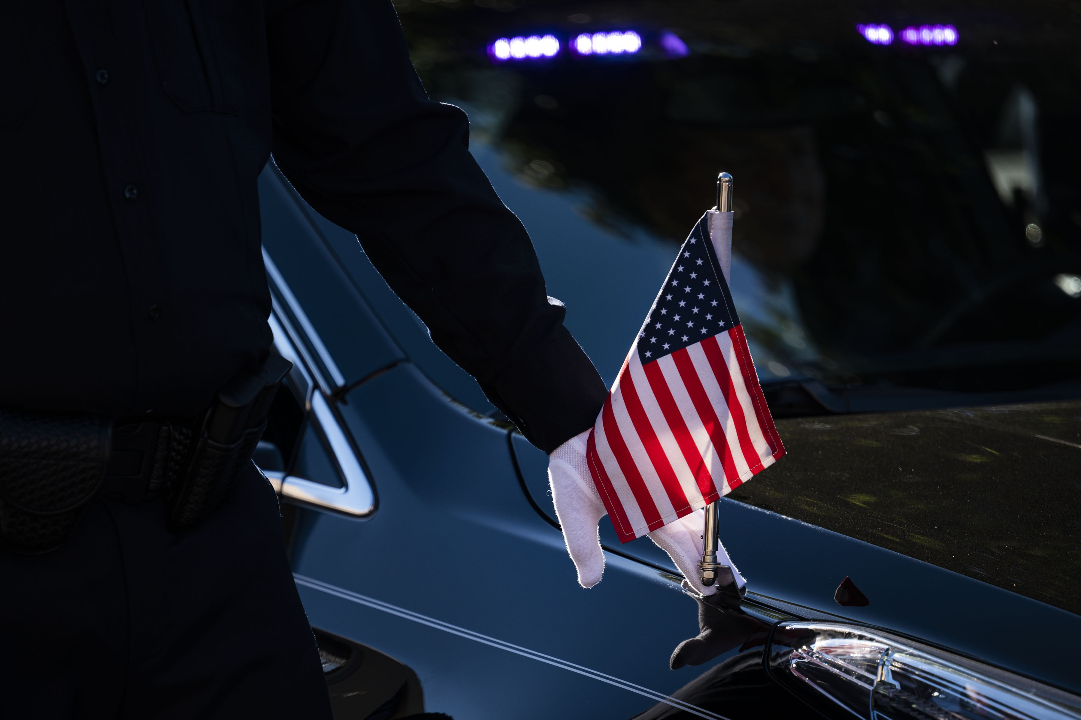 An Arvada Police officer touches the fender of the hearse carrying fallen Arvada Police officer Dillon Vakoff as it drives to the front of the church on Friday, Sept. 16, 2022, at Flatirons Community Church in Lafayette, Colo. Vakoff was killed in the line of duty last Sunday while responding to a call in Arvada. (Timothy Hurst/The Denver Gazette) (TimHursttim.hurst@gazette.comhttps://secure.gravatar.com/avatar/aca82bd62b4ee425c598527cd6faa1b1?d=mm&r=g)