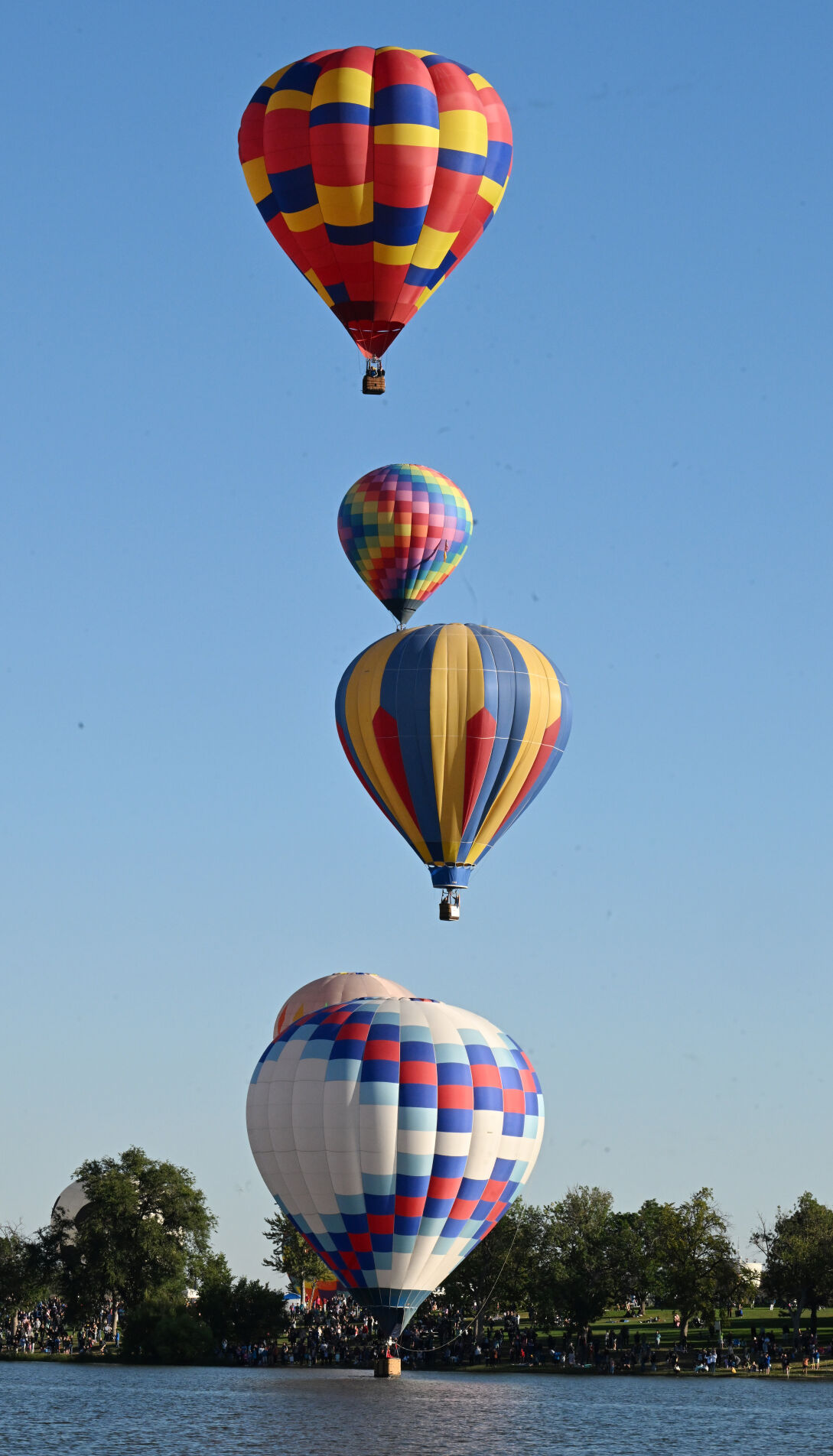 A column balloons heads for Prospect Lake in the Labor Day Lift Off on Sunday, Sept. 4, 2022.  (Photo by Jerilee Bennett, The Gazette) (Jerilee Bennett)