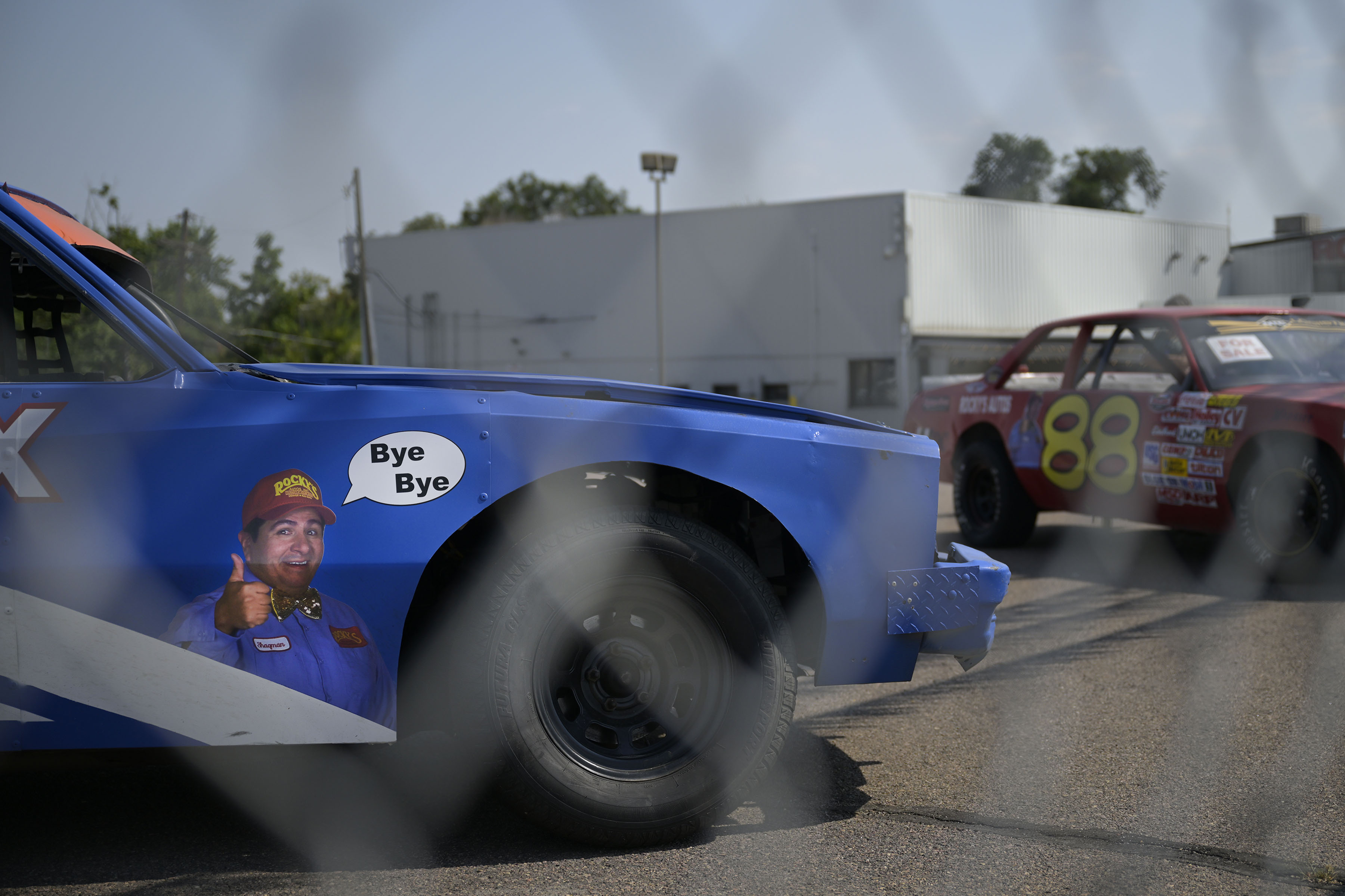 Rocky's Autos, Inc.’s pitchman, Shagman, played by actor Ron Vigil, sends a farewell message from the fender of one of the dealership’s old race cars sitting on the largely empty front lot on Wednesday, Sept. 7, 2022, in Denver, Colo. (Timothy Hurst/The Denver Gazette) (TimHursttim.hurst@gazette.comhttps://secure.gravatar.com/avatar/aca82bd62b4ee425c598527cd6faa1b1?d=mm&r=g)