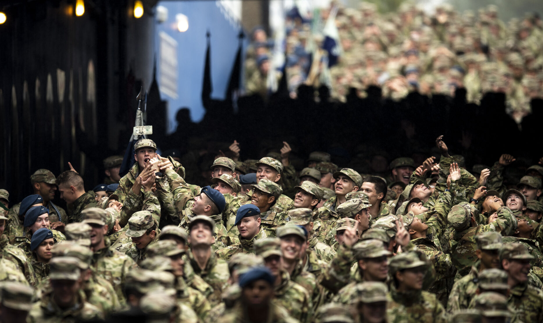Cadets jump for a $20 as they wait in the tunnel before the Air Force Falcons game against Colorado University Buffaloes at Falcon Stadium in Colorado Springs, Colo., on Saturday, Sept. 10, 2022. (The Gazette, Parker Seibold) (Parker Seibold/ The Gazette)