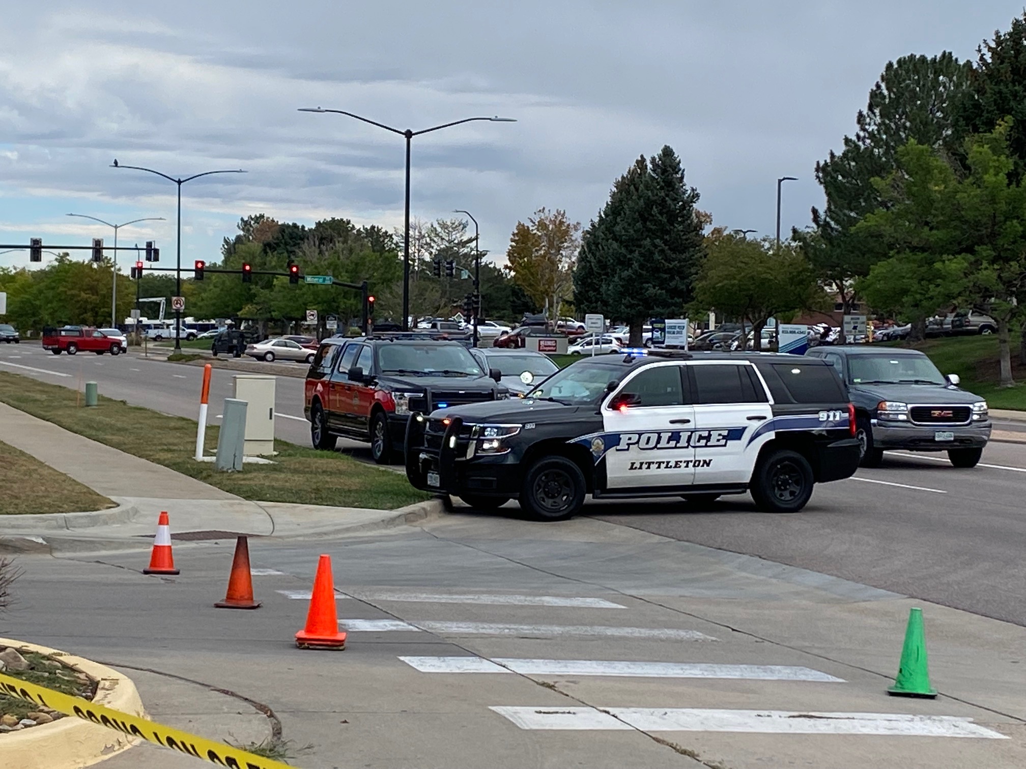 A squad of Littleton Police cars help maneuver traffic on West Mineral Avenue to keep vehicles from entering Southbridge Shopping Center. Just 100 yards away, the Arapahoe County Sheriff's bomb squad located a pipe bomb which was described as
