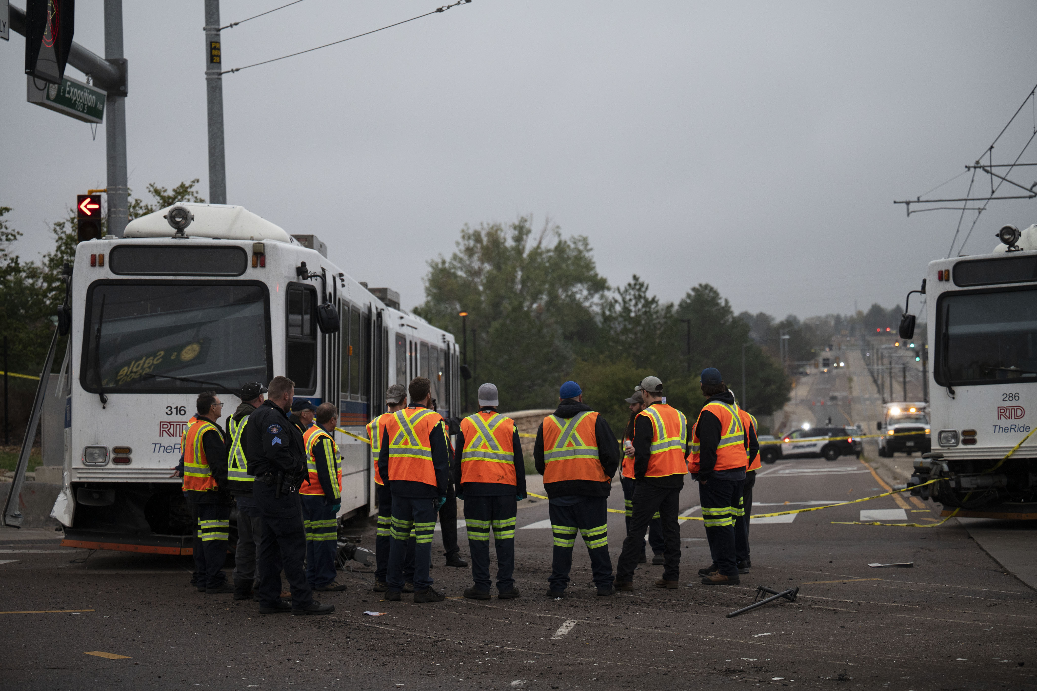 A RTD light-rail train sits on the sidewalk and another section sits derailed on the tracks as crews work the scene at the intersection of East Exposition Avenue and South Sable Boulevard on Wednesday, Sept. 21, in Aurora, Colo.(TIMOTHY HURST/THE DENVER GAZETTE) (TimHursttim.hurst@gazette.comhttps://secure.gravatar.com/avatar/aca82bd62b4ee425c598527cd6faa1b1?d=mm&r=g)
