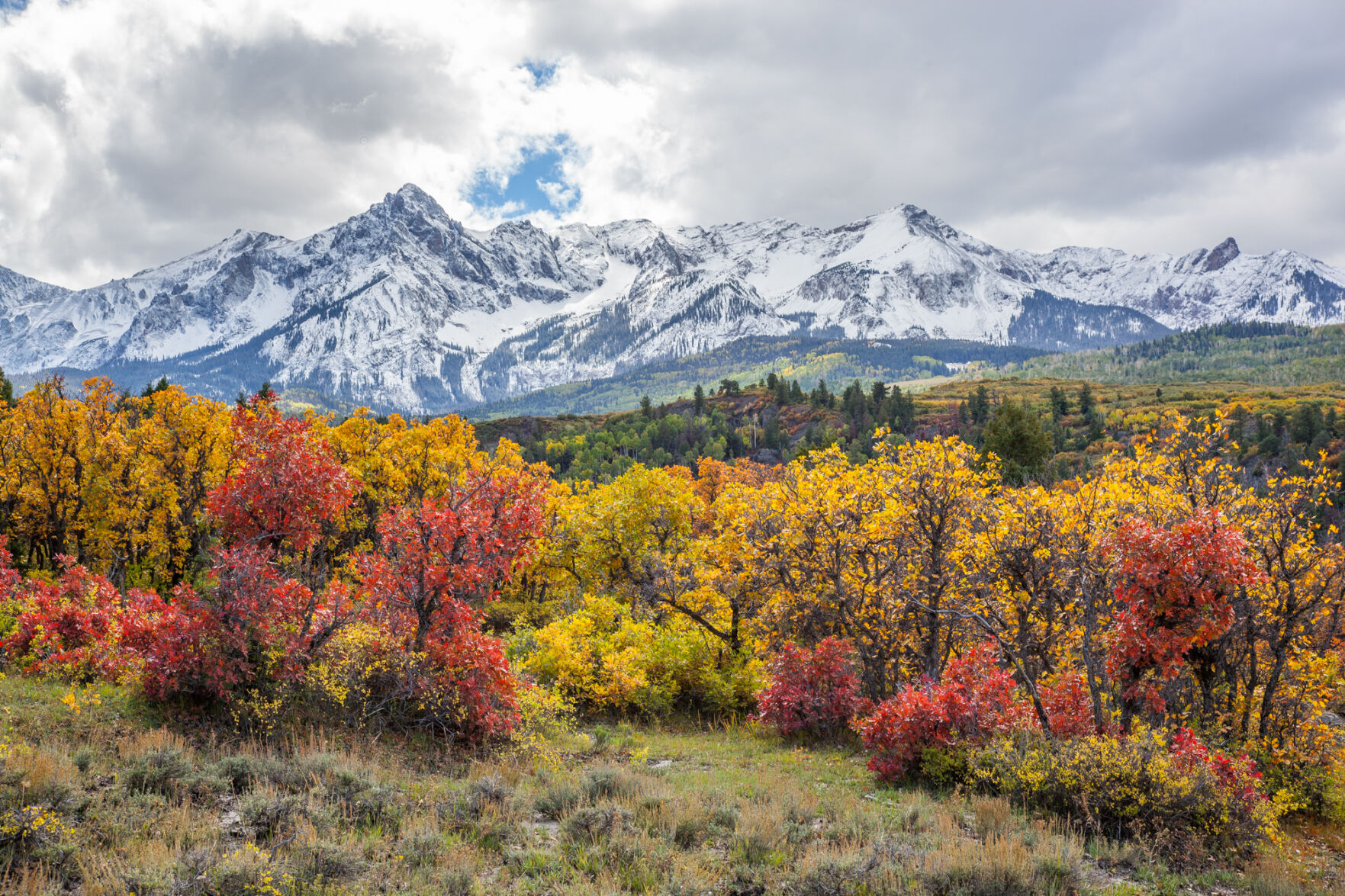 Mount Sneffels looms over a colorful stand of Gambel oak along a Ouray County road, as captured by John Fielder. The photographer’s 2023 scenic calendar is available at Amazon and Barnes and Noble. Photo by John Fielder